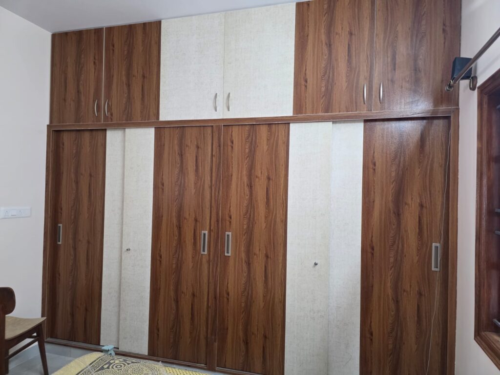 Custom UPVC sliding wardrobe with loft storage in Hosur